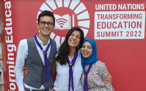 Three Scouts who are Youth Representatives to the World Organization of the Scout Movement pose together at the United Nations' Transforming Education Summit in New York City