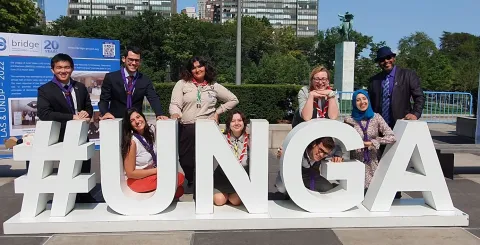 Scouts post in front of a #UNGA sign at the UN General Assembly in New York City