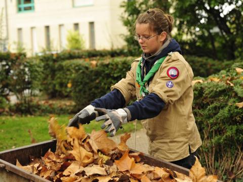 Scouts in Switzerland works cleaning their local community in autumn