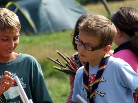Two children wearing scout scarves.
