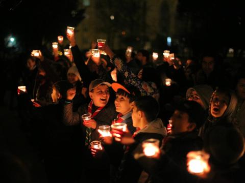 Scouts holding candles