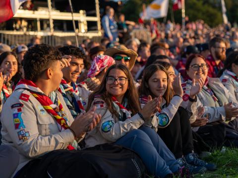 The Maltese contingent claps during the opening campfire.