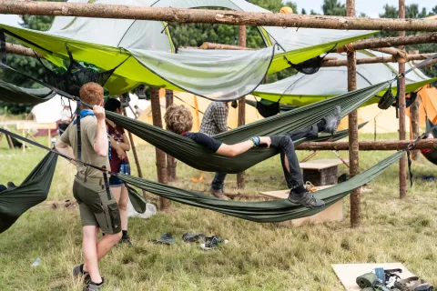 Scouts relax in hammocks at a national Jamboree in Denmark (Spejdernes Lejr 2022)