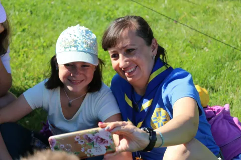 Scout from Ukraine smiling while taking a picture