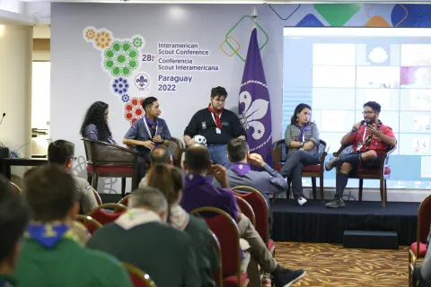 A panel of Scouts is on stage during the Interamerican Scout Conference