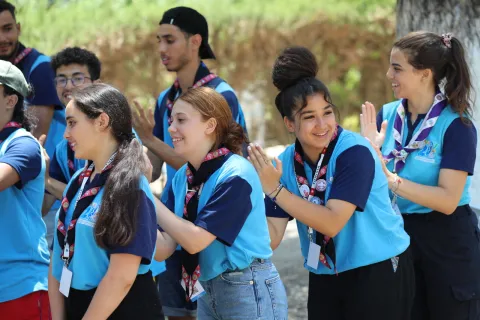 Scouts play a game in a line during the Arab Scout Moot