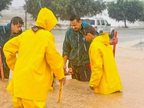 Libyan Scouts draining water
