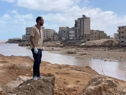 a Libyan Scout seeing the damages of the floods