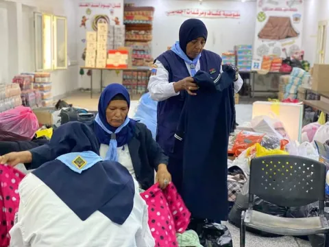 Female Libyan Scouts preparing the boxes of donation