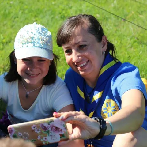 Scout from Ukraine smiling while taking a picture